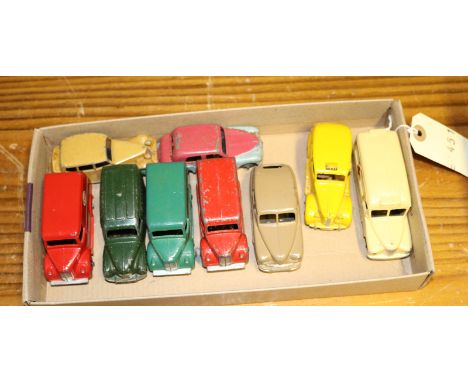 9 Dinky Toys. Standard Vanguard (153) with covered rear wheel arches in fawn. Austin Taxi (254) in yellow. Daimler Ambulance 