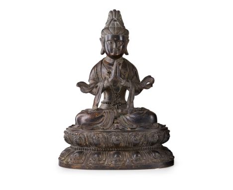 清 銅鑄觀音坐像 cast seated in dhynasana on a double-lotus base, casts down in graceful expression with hands in anjali mudra , the 