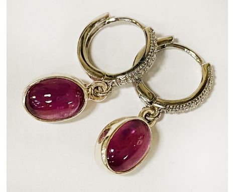 PAIR OF CABACHON RUBY LEVER BACK EARRINGS