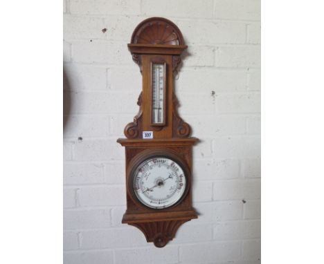 An Oak Aneroid Barometer with Thermometer - 73 cm tall