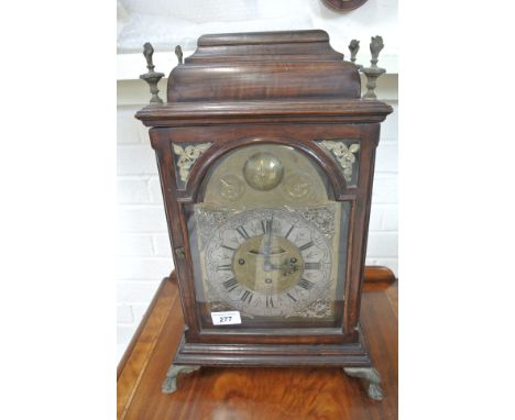 An 18th Century mahogany bracket Viennese Clock  with a three train spring movement striking on two bells with a brass dial w