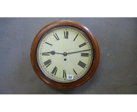 An Oak Fusee Wall Clock with a 12" painted dial and chain - driven movement with pendulum and key - working in saleroom