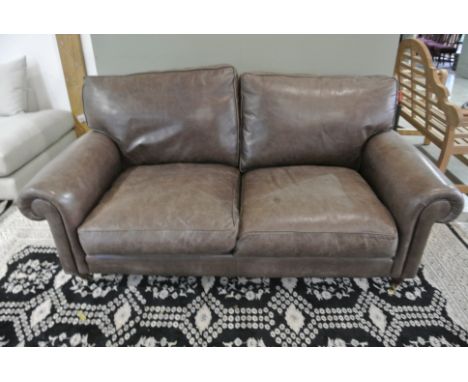 A Laura Ashley Distressed Leather Sofa - 183 cm wide - used but in good condition