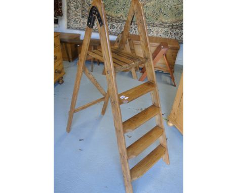A pine and beech four-step ladder with platform, cleaned and waxed for decorative use - good condition, recently restored