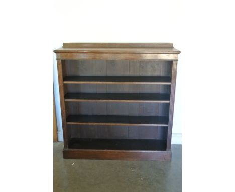 A Victorian four shelf oak bookcase raised on plinth base - 120cm x 30cm x 128cm high