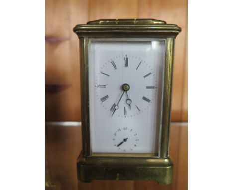 A Brass Carriage Clock - alarm striking on a bell - 12 cm tall - working in saleroom