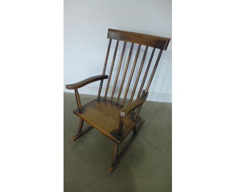 A 19th century ash and elm stick back rocking chair