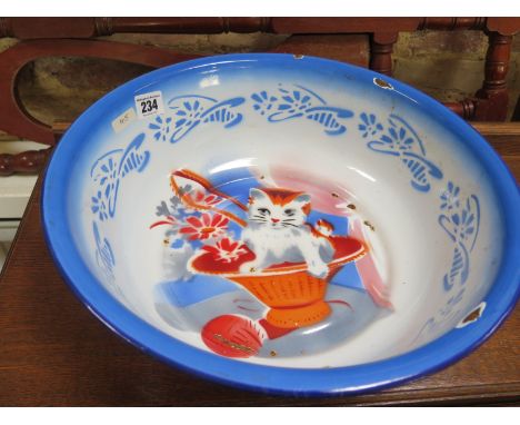 An enamel bowl with charming painted cat decoration on base