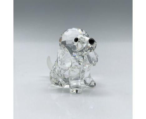 Crafted from faceted clear crystal, this adorable piece features a matte crystal tail, complemented by striking black eyes an