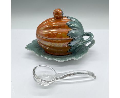 High iridescent glaze dish in the shape of a pumpkin, placed on a leaf-shaped tray. The stem and the small pumpkin formed the