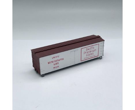 HO scale model kit comes with instructions and some parts. It is a replica of a 36 foot refrigerator car with an advertisemen