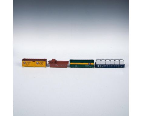 Four model train cars from Athearn that have been scaled from railroad blueprints which include the Schlitz Beer car, Norfolk