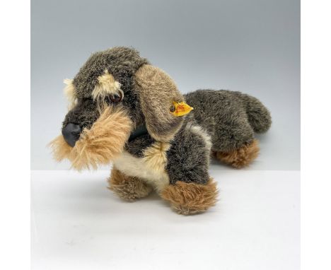 This charming dachshund, made of artificial fur of 4 different types and colors, unjointed. Brown plastic eyes and black leat