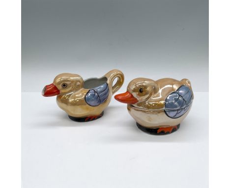 Hand painted high glazed iridescent cafe tableware. Creamer and covered sugar bowl shaped as tan-colored ducks with blue wing