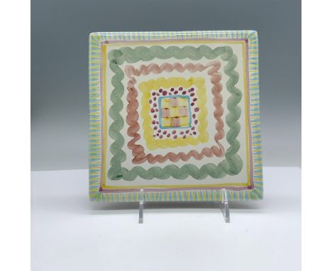 Beautiful ceramic trivet tile decorated with pastel colors. The cork bottom is stamped with the Victoria and Richard MacKenzi