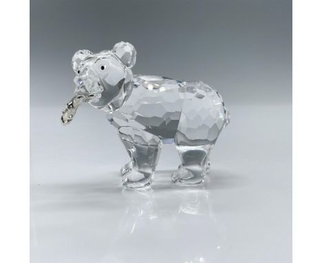 Clear faceted crystal body with black inset eyes holding a salmon fish. Swarovski backstamp. This item has its original box: 