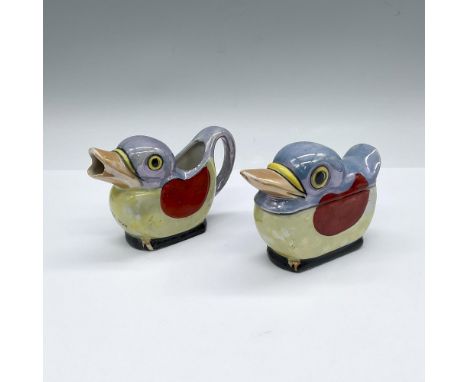 Hand painted high glazed iridescent cafe tableware. Creamer and covered sugar bowl shaped as ducks in blue, red and yellow co