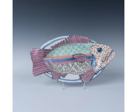 Whimsical fish-shaped ceramic platter decorated in pastel colors. Wire for hanging is attached. The back is stamped with the 