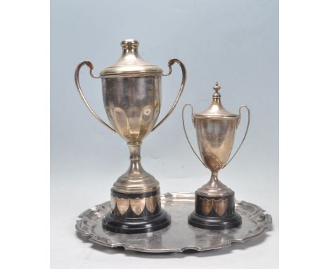 A 1950's silver hallmarks trophy / cup being engraved - The Fred Mildred Memorial Cup having twin handles and conical lid wit