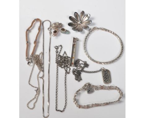 A collection of stamped silver ladies jewellery to include a chainmail bracelet, a flower shaped pendant, a bar gate bracelet