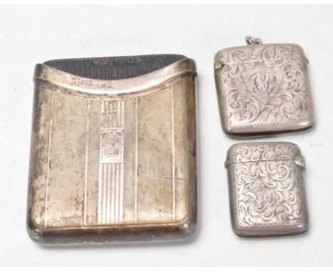 Two early 20th century Edwardian silver hallmarked vesta cases. both having hinged lids and foliate decoration engraved to th