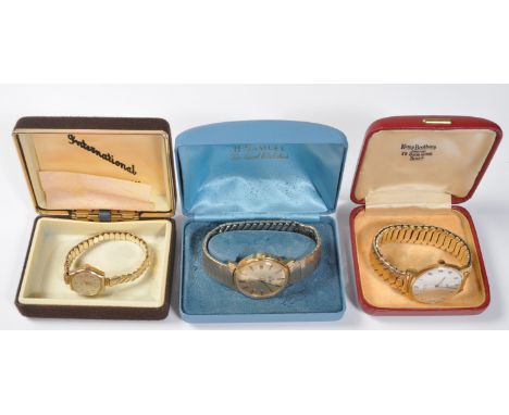 A collection of three vintage 20th century watches comprising of a men's Rotary GT automatic, a Strad Genieve ladies watch to