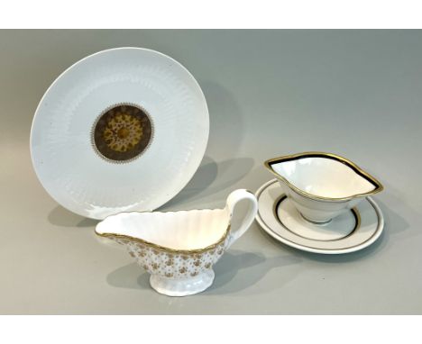 Two sauce boats by Royal Copenhagen and Spode - the Royal Copenhagen sauce boat with fixed stand, in white with black and gil
