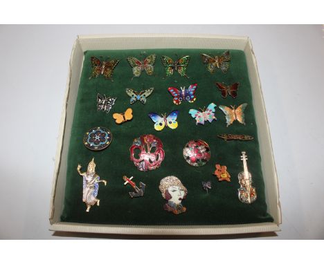 A box of enamel and other decorated brooches 
