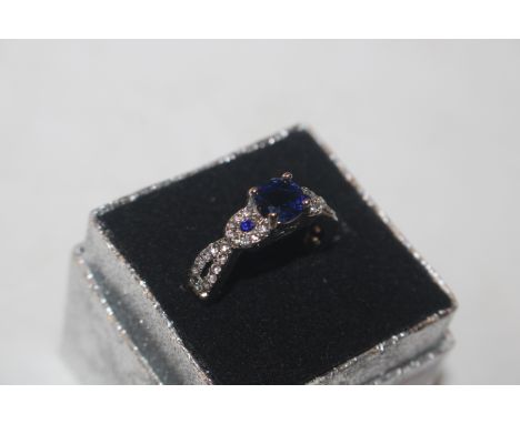 A blue and white stone set dress ring 