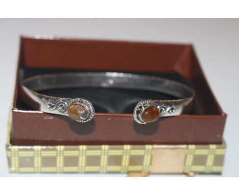 A 925 silver and tigers eye set bangle 