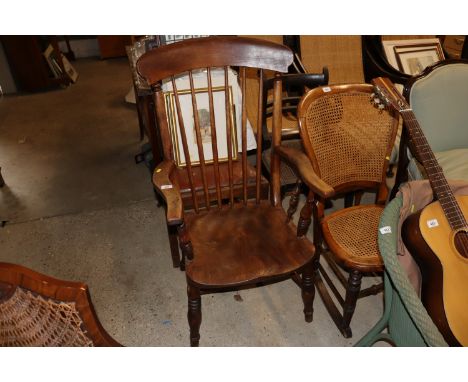 An elm seated stick back armchair 