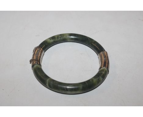 A vintage Chinese hardstone and white metal bangle, approx. 45gms total weight 