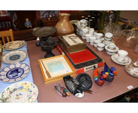 Four painted ducks; a face mask; scales and weights; pottery jug and various games