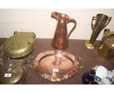 An Art Nouveau copper and brass twin handled tray; and a J.S. & S. copper Art Nouveau style jug 
