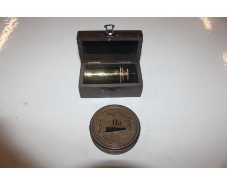 A reproduction brass telescope and a reproduction brass Titanic commemorative compass 