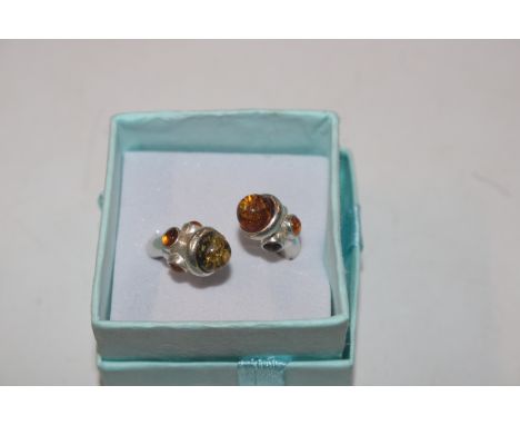 A Hallmarked Sterling silver and amber torque ring, size O/P, approx. 6gms 