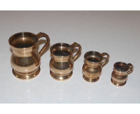 A graduated set of four bell metal measures and a W.M Morrison &frac12; gill and &frac14; gill top and tail measure