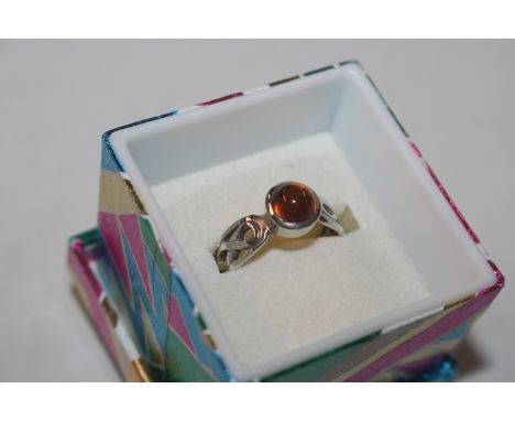 A Celtic style Sterling silver and amber ring, size L/M