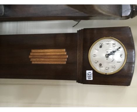 A Mahogany grandmother clock of Art Deco design with a silvered dial.