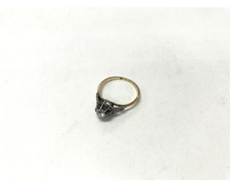 An 18ct gold and platinum diamond ring. Size approx M, weight approx 2g.