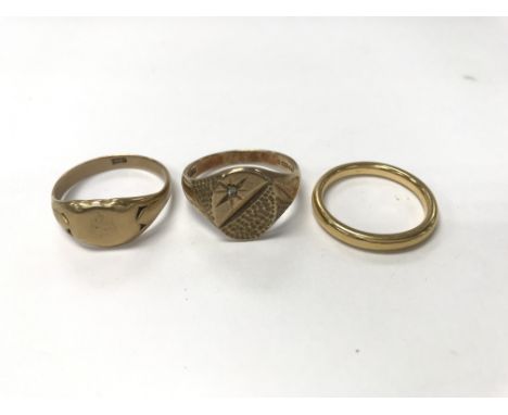 Three gold rings. One 18ct, size approx X, weight approx 6.8g. One 9ct, weight approx 6.2g, size approx W. One 22ct, weight a
