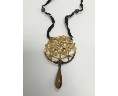 A vintage tortoiseshell type necklace.