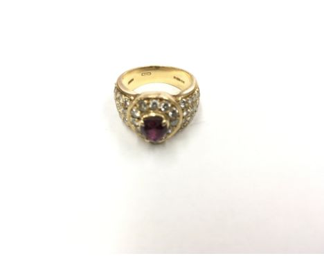An 18ct ruby & diamond ladies ring. Ring size K.