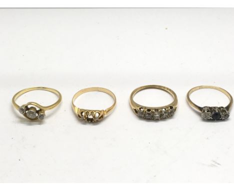 Four gold and stone set rings.Approx K,M and O, 8.4g