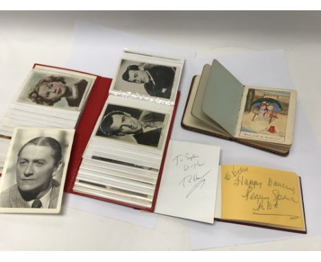A vintage autograph album dating from the First World War period containing original artwork. Another modern autograph book c