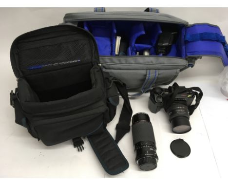 A Pentax SLR 28-80mm camera plus a Sigma 300mm lens plus filters