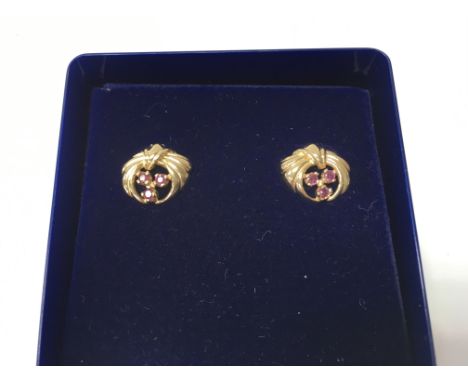 A pair of 9ct gold and ruby earrings. Weight approx 2.39g