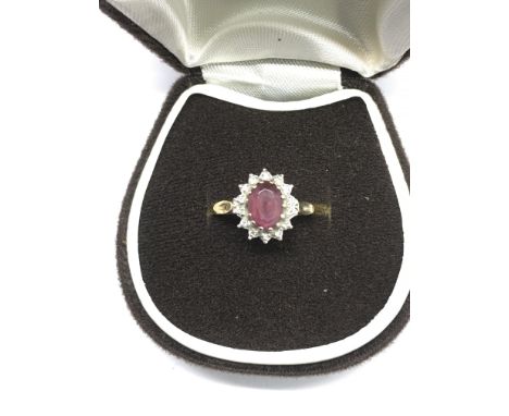 A 9ct gold cluster ring set with red and white stones.Approx M