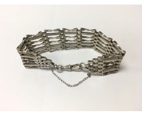 A sterling silver gate bracelet. Weight approx 21.32g