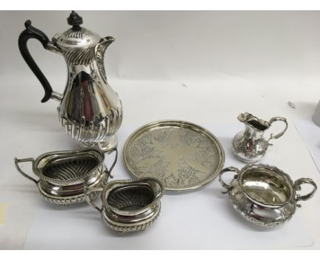 A Mappin Brothers coffee pot, two milk jug and sucrier sets and a tray